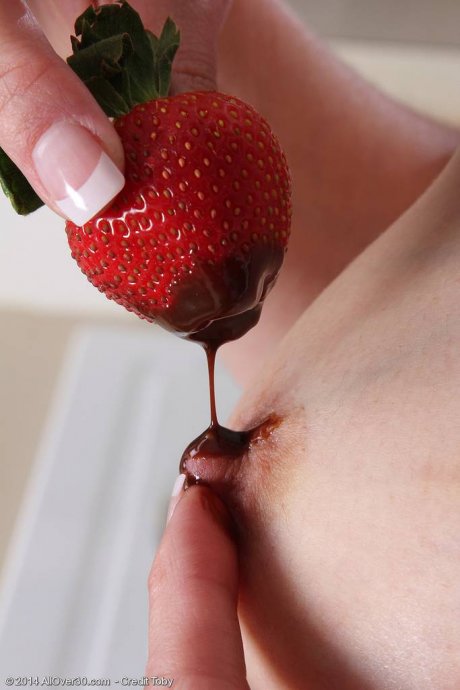 All Over 30 Skinny Celeste Carpenter slips a strawberry in her puss at AllOver30 porn pics