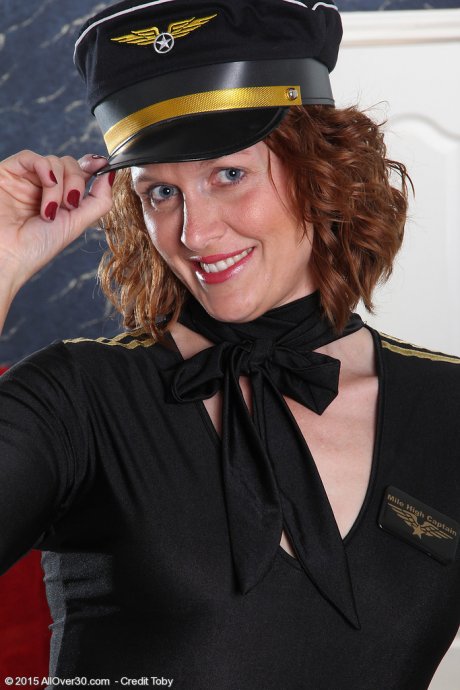 All Over 30 Get ready to fly the skies with 35 year old redhead Roxanne Clemmens at AllOver30 porn pics