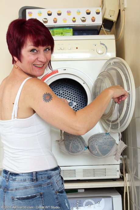 All Over 30 Penny Brooks doing her laundry at AllOver30 porn pics