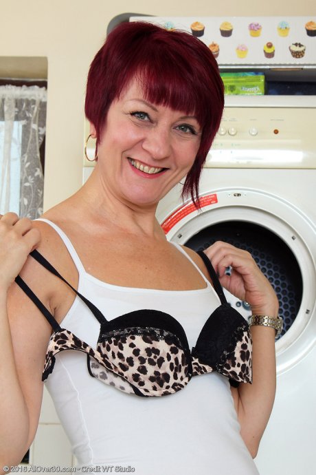 All Over 30 Penny Brooks doing her laundry at AllOver30 porn pics