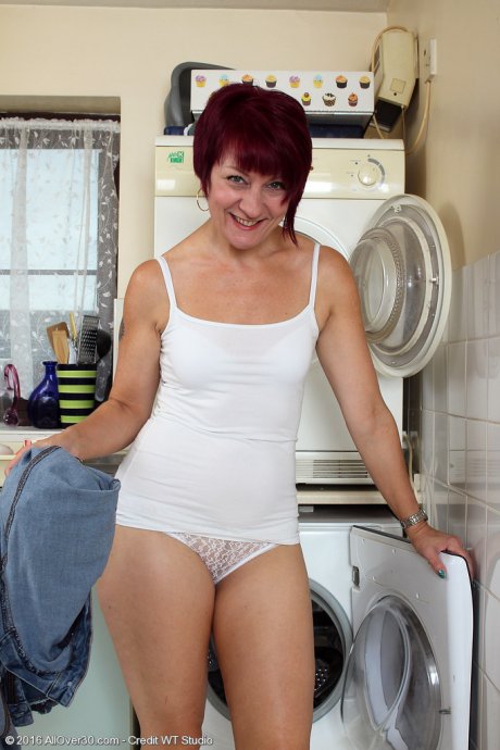 All Over 30 Penny Brooks doing her laundry at AllOver30 porn pics