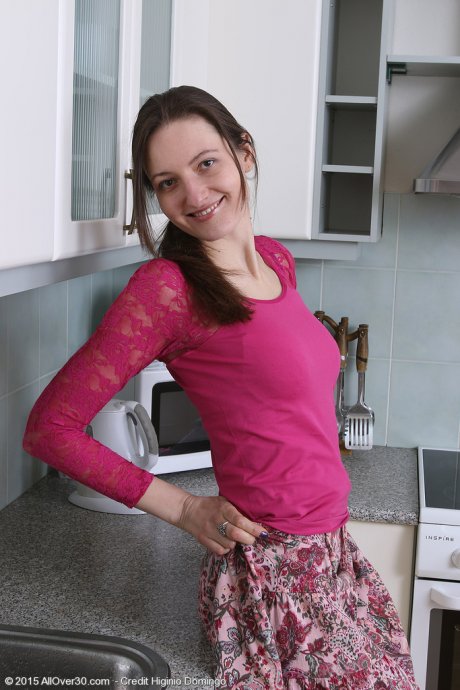 All Over 30 32 year old Mariona showing off her tight hairy pussy in the kitchen at AllOver30 porn pics